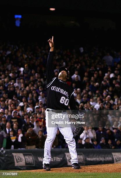 Relief pitcher Manny Corpas of the Colorado Rockies points to a pop fly out in Game Four of the National League Championship Series against the...