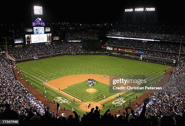 The Colorado Rockies celebrate after defeating the Arizona Diamondbacks in Game Four of the National League Championship Series at Coors Field on...