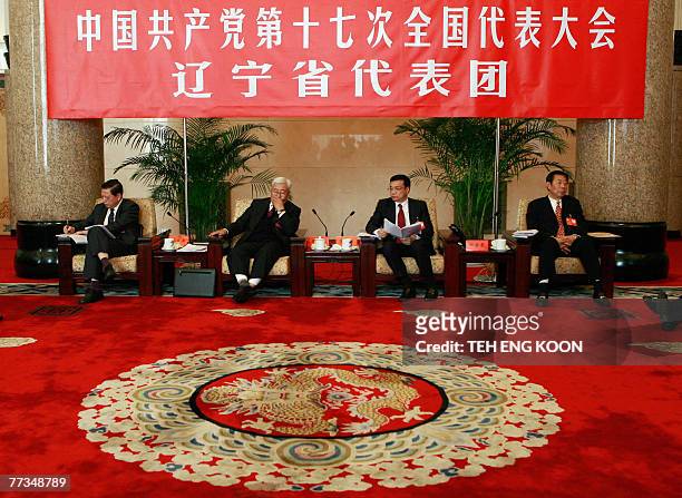 Liaoning province chief Li Keqiang presides over a meeting with Liaoning province delegation on the sidelines of the 17th Communist Party Congress at...