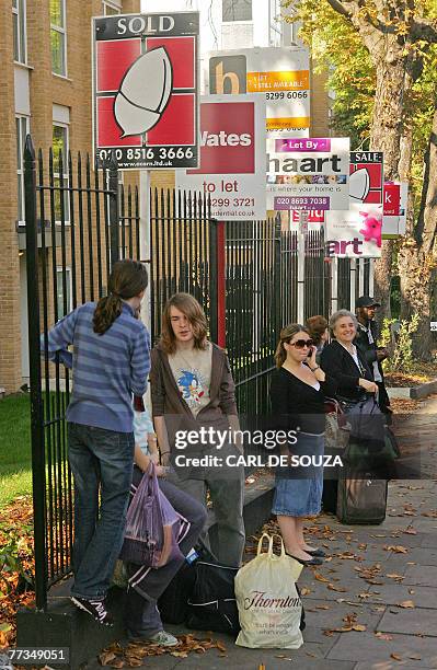 Property sale boards are pictured in Forest Hill, in south-east London, 15 October 2007. AFP PHOTO/CARL DE SOUZA