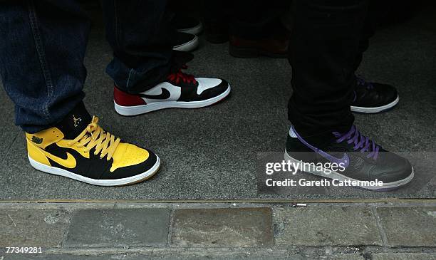 People wait outside the Nike Town store on London's Oxford Street to buy the Limited Edition 'What The Dunk Shoes' on October 16, 2007 in London,...