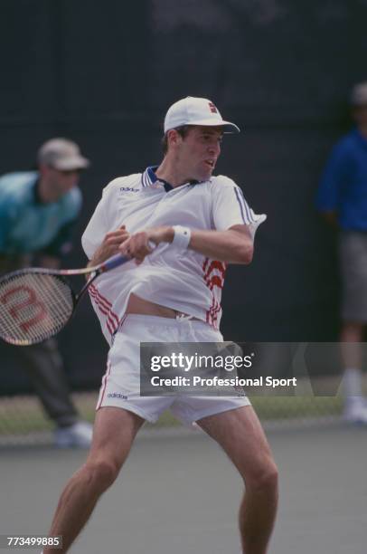 Canadian born British professional tennis player Greg Rusedski of the Great Britain team, pictured in action during competition to reach the third...