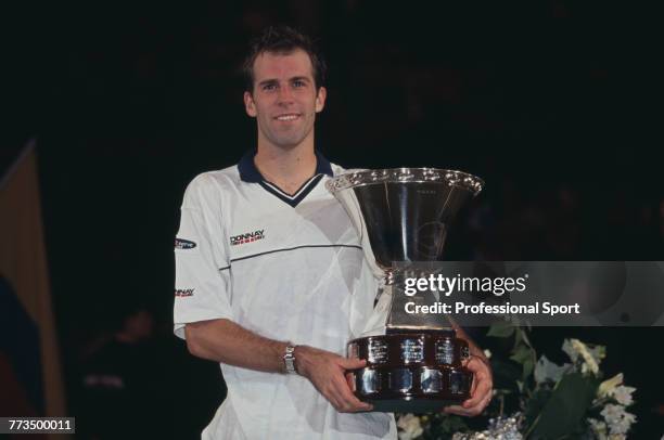 Canadian born British tennis player Greg Rusedski pictured holding the trophy after beating Tommy Haas of Germany 6-3, 6-4, 6-7, 7-6 to win the final...