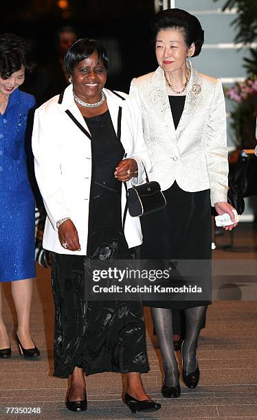 Namibia's first lady Penehupifo Pohamba walks with the Japanese first lady Kiyoko Fukuda upon her arrival at the Prime Minister's Official Residence...