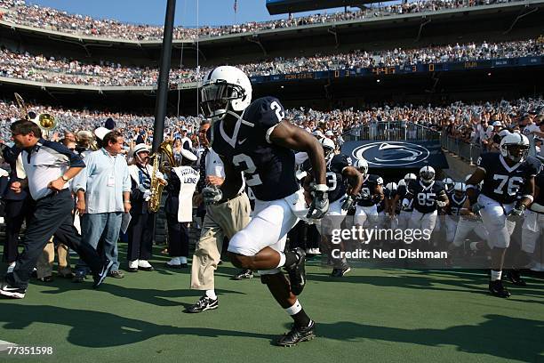 Wide receiver Derrick Williams of the Penn State Nittany Lions runs onto the field from the tunnel with the team against the University of Iowa...