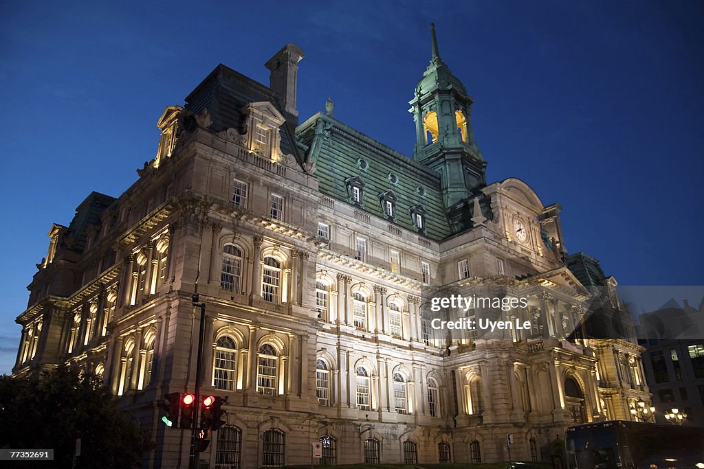 Dusk photograph of the Hotel de Ville (city hall) building in Montreal, Quebec, Canada.
