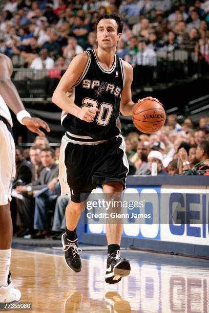 Manu Ginobili of the San Antonio Spurs brings the ball upcourt during the game against the Dallas Mavericks at American Airlines Center on October 9,...