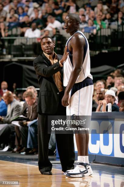 Head coach Avery Johnson talks to DeSagana Diop of the Dallas Mavericks during the game against the San Antonio Spurs at American Airlines Center on...