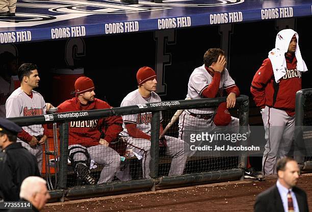 The Arizona Diamondbacks react after being defeated by the Colorado Rockies in Game Four of the National League Championship Series at Coors Field on...