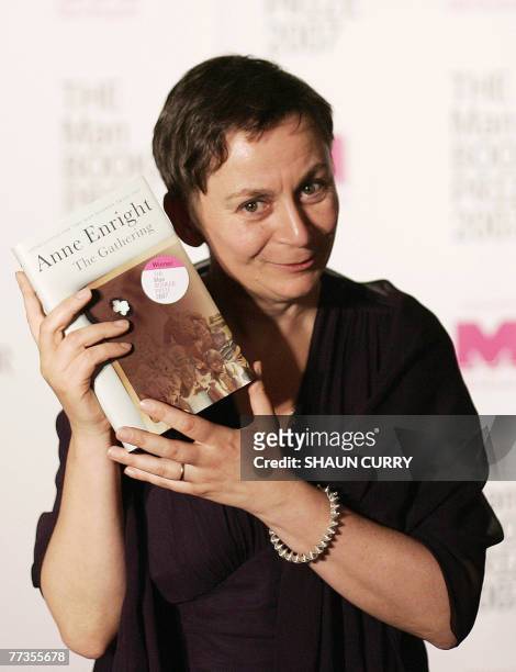 Irish author Ann Enright celebrates after winning the Man Booker Prize for fiction for for her family epic "The Gathering" 16 October 2007 in London....