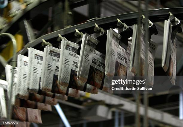 Freshly printed copies of the San Francisco Chronicle roll off the printing press at one of the Chronicle's printing facilities September 20, 2007 in...