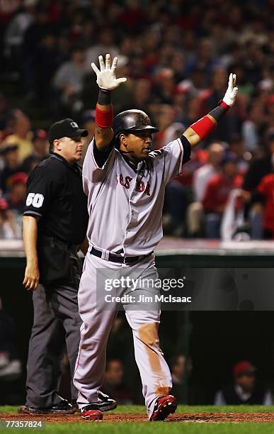 Manny Ramirez of the Boston Red Sox celebrates after hitting a home run in the sixth inning against the Cleveland Indians during Game Four of the...