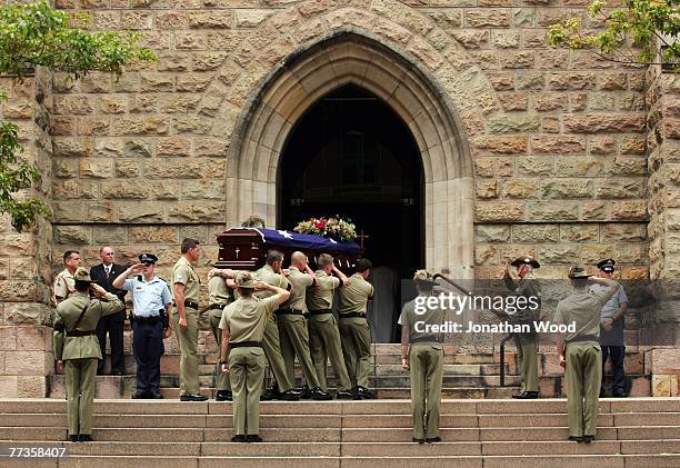 The casket of Trooper David Pearce is carried into the Cathedral of Saint Stephen during his military funeral on October 17, 2007 in Brisbane,...