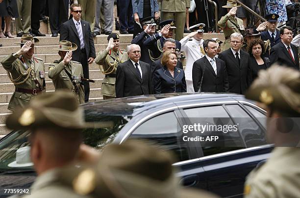 Australian Prime Minister John Howard and Labor Leader Kevin Rudd pay their respects with their wives, Janette Howard and Therese Rein , after the...