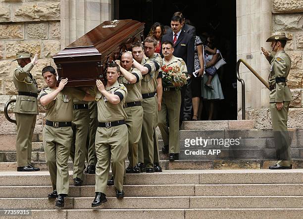 Australian Army personnel carry the coffin of Trooper David Pearce from the Cathedral of Saint Stephen in Brisbane, 17 October 2007. Trooper Pearce...
