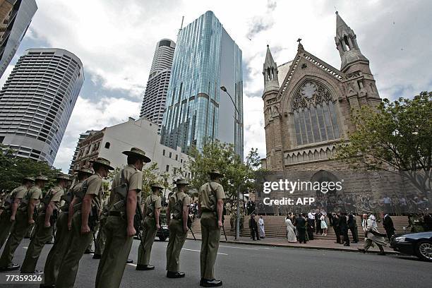 Australian Army personnel form a guard of honour during the funeral service for Trooper David Pearce at the Cathedral of Saint Stephen in Brisbane,...