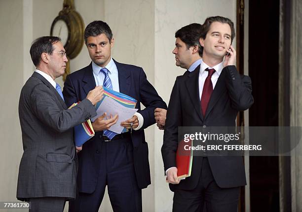 French Elysee General secretary Claude Geant, government spokesman Laurent Wauquiez, Elysee press officer Franck Louvrier, and Elysee spokesman David...