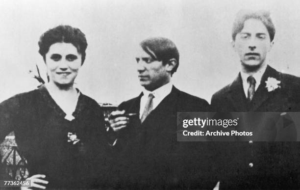 Pablo Picasso, centre, with his first wife Olga Khokhlova and French artist Jean Cocteau, 1917.