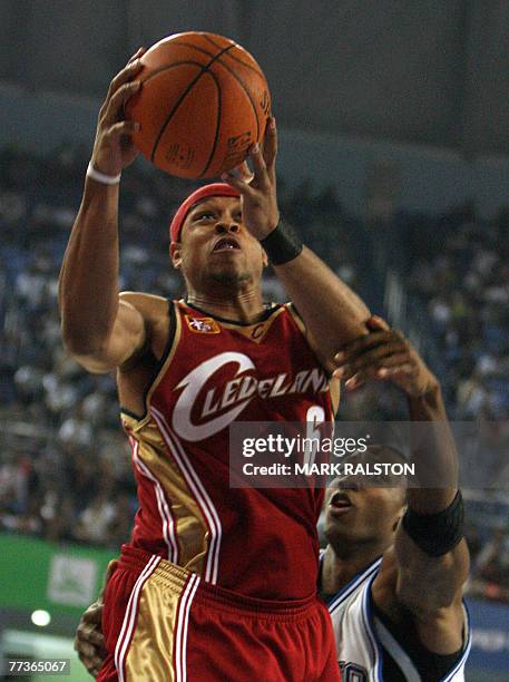 Orlando Magic player Dwight Howard tries to block Shannon Brown from the Cleveland Cavaliers during their NBA China Games 2007 exhibition basketball...