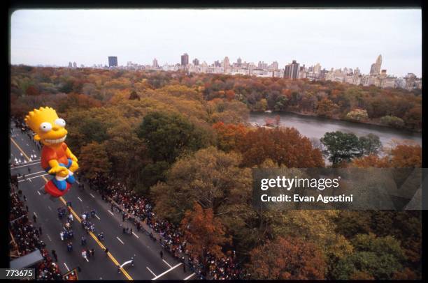 Giant balloon of Bart Simpson floats in the air at the 69th Macy's Thanksgiving Day Parade November 23, 1995 in New York City. The parade was...