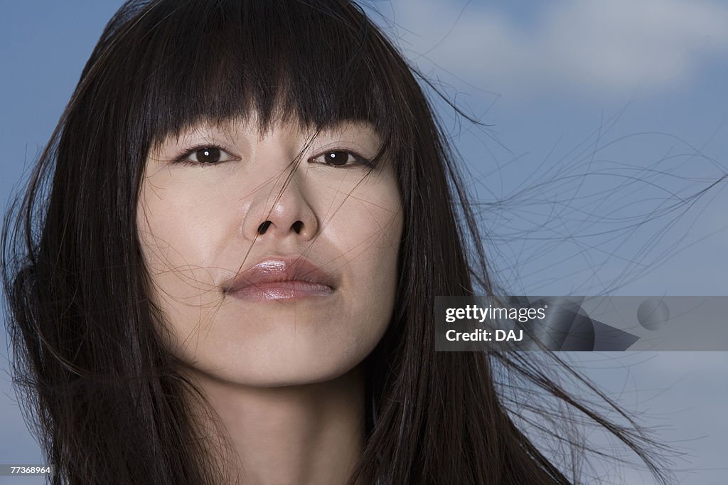 Young woman, smiling, front view