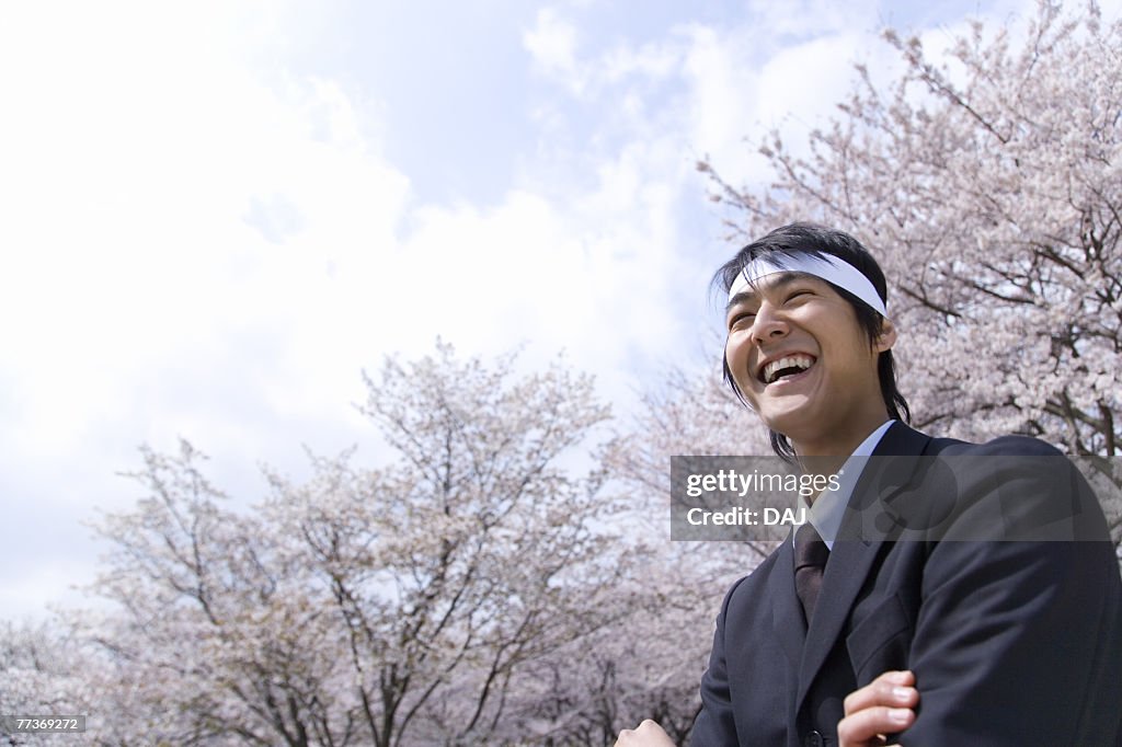 Businessman Standing With Crossing Arms, Low Angle View, Head and Shoulder, Copy Space