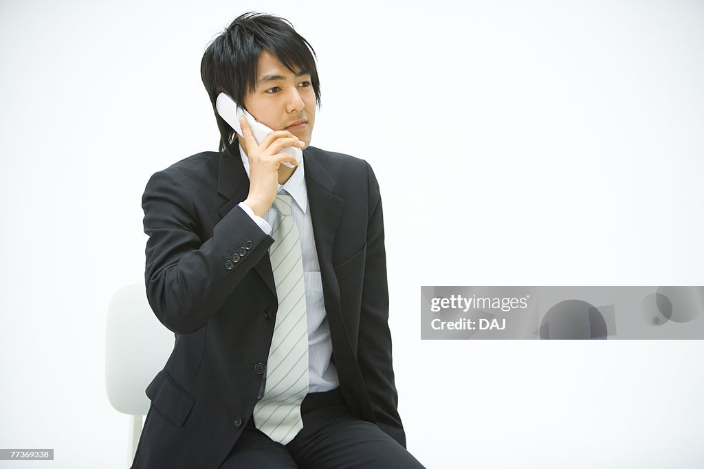 Businessman Using a Mobile Phone, Front View, Copy Space 