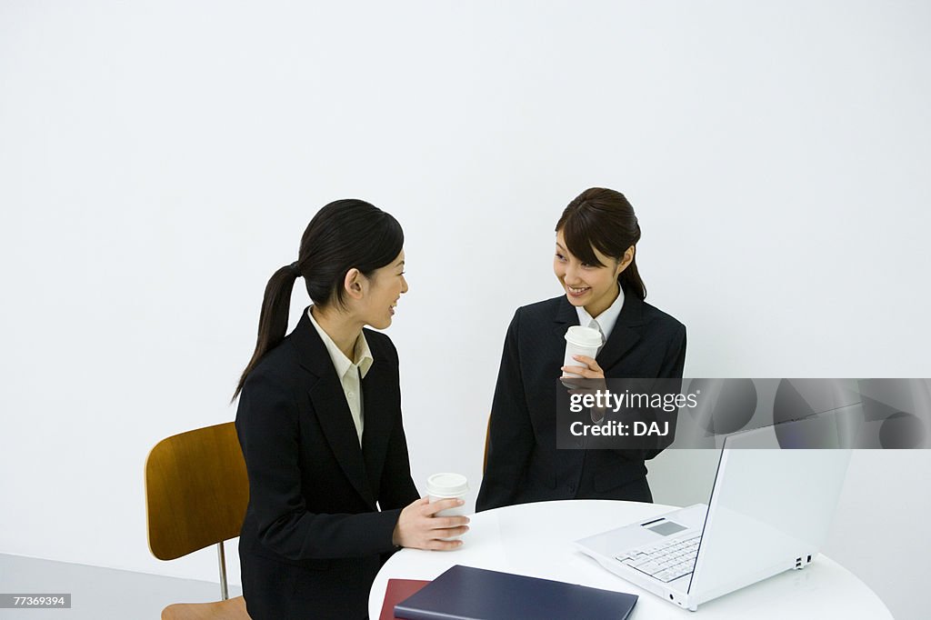 Businesswomen Talking In Office, Side View, Front View, Waist Up