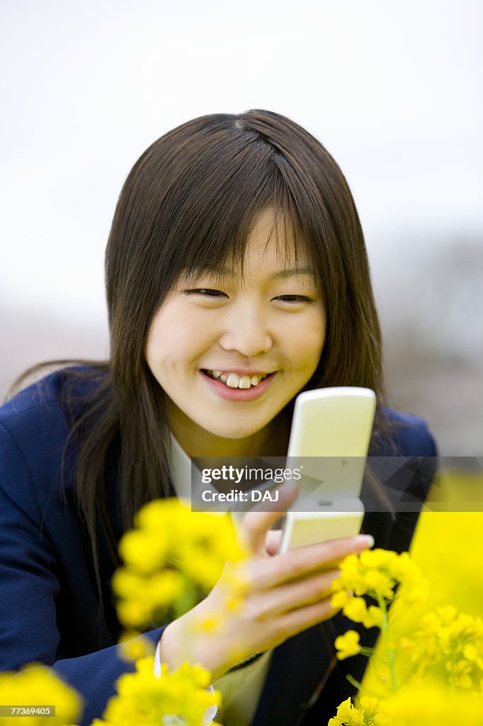 High School Student Taking Picture with Mobile Phone, Differential Focus