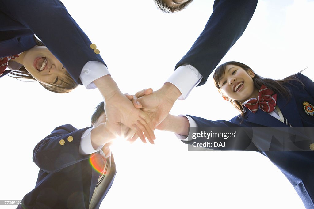 High School Student in Huddle with hands together