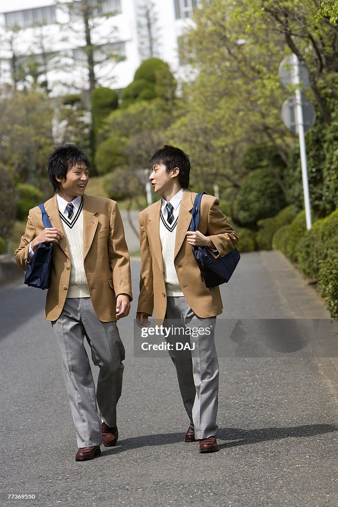 High School Boys Walking on Street to Home