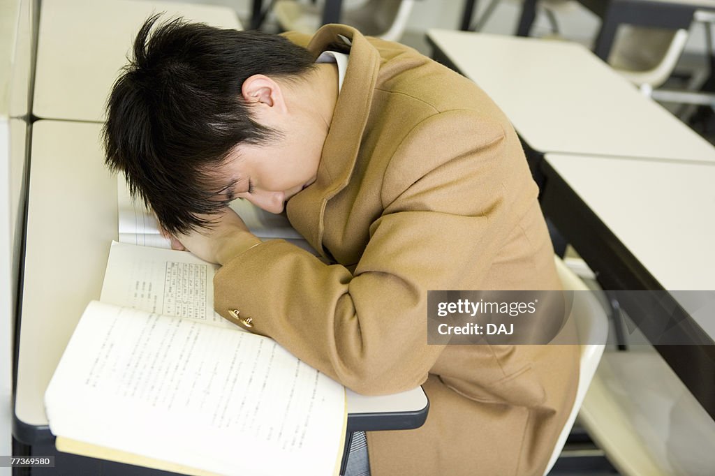 High School Boy Sleeping During Lecture