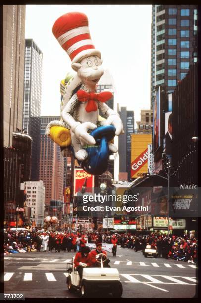 Giant balloon of Dr. Seuss'' Cat In The Hat floats in the air at the 69th Macy's Thanksgiving Day Parade November 23, 1995 in New York City. The...
