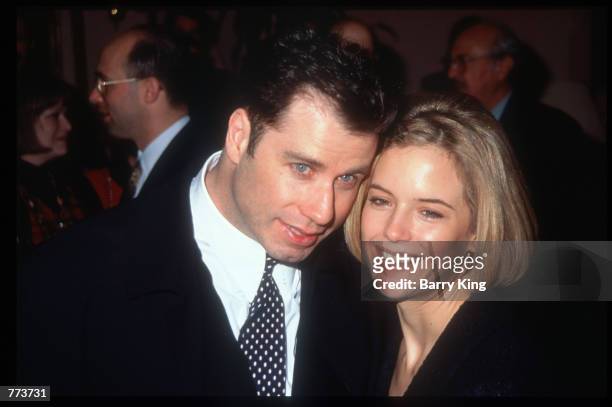 Actor John Travolta stands with his wife Kelly Preston at the Los Angeles Film Critics Awards January 17, 1995 in Los Angeles, CA. Celebrities and...
