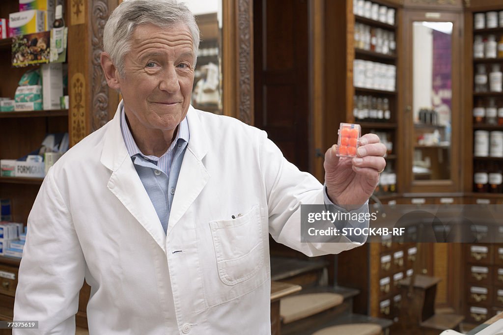 Pharmacist holding pills