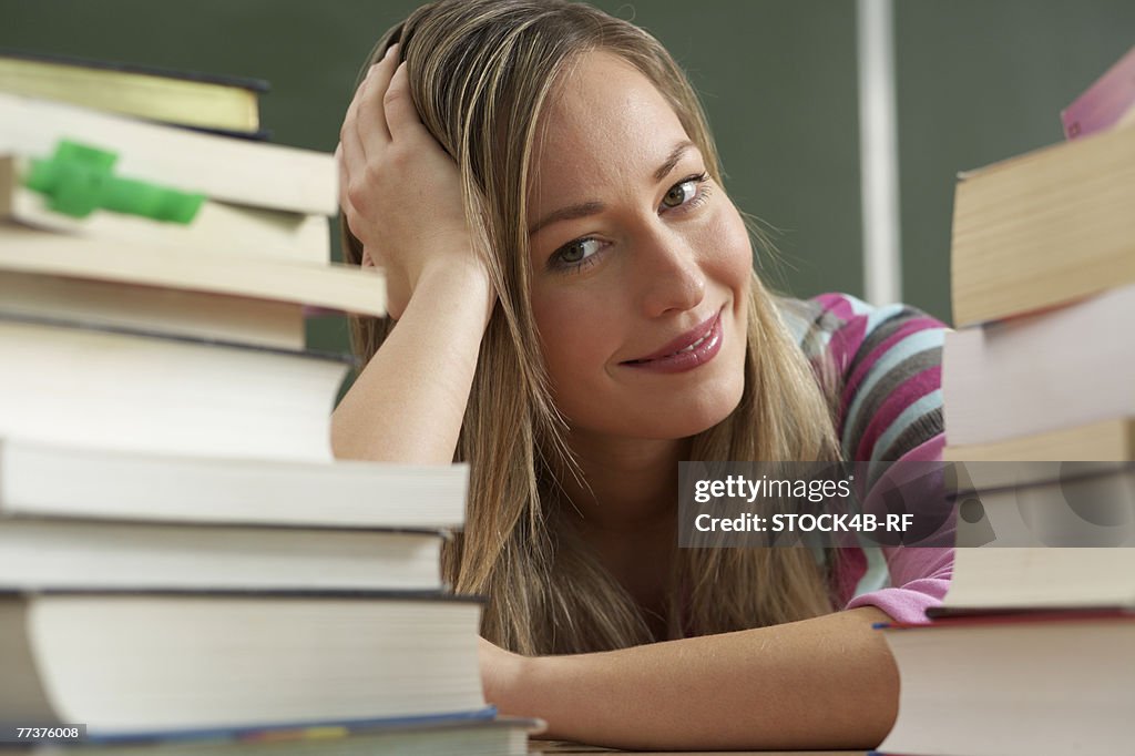 Smiling woman in the middle of books