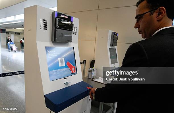 Rob Cimino, a representative from Clear, demonstrates how biometrics is used at the Clear express security lane October 17, 2007 at San Francisco...