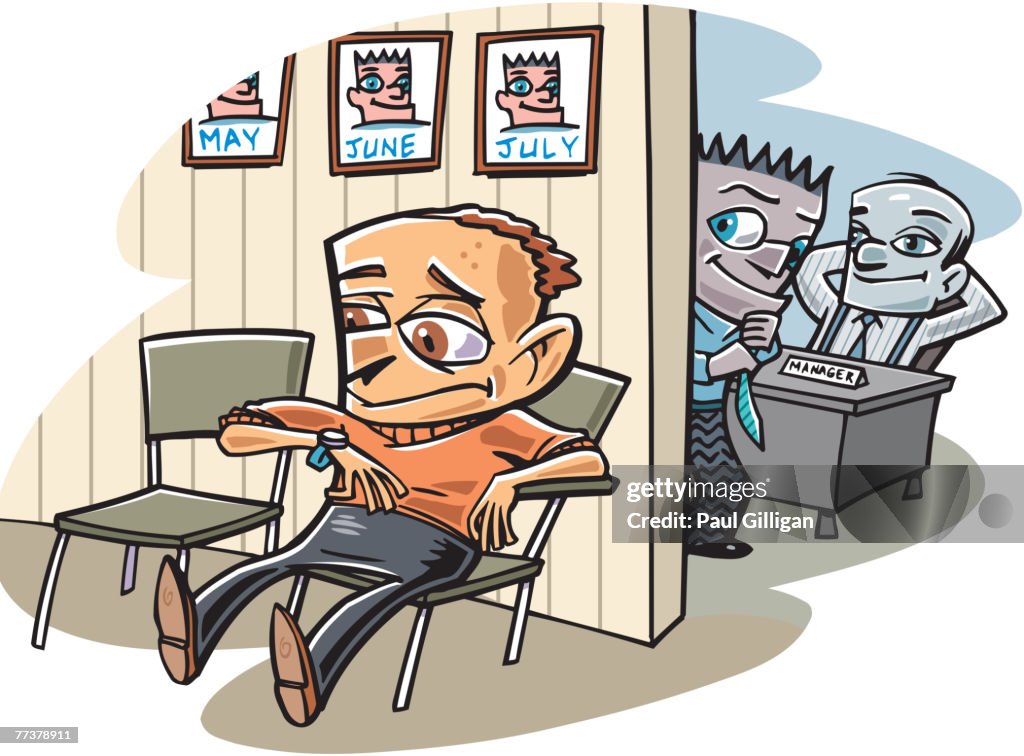 A man sitting in the waiting room while the employees look on