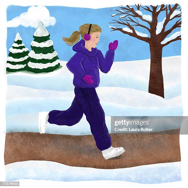 a woman jogging in the park in winter - jogging winter stock-grafiken, -clipart, -cartoons und -symbole