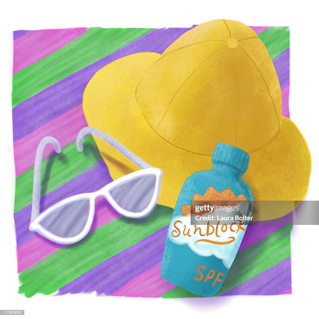 Essential accessories for a day at the beach - hat, sunglasses, and sunblock