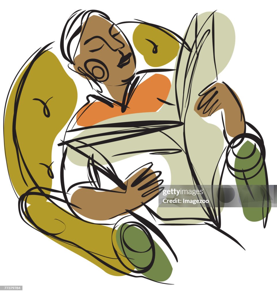 Man relaxing and reading a newspaper