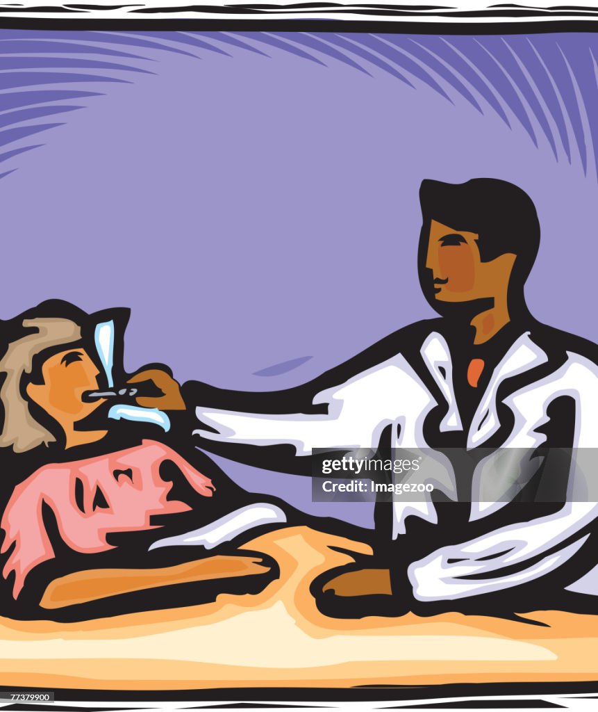 A doctor taking a girl's temperature