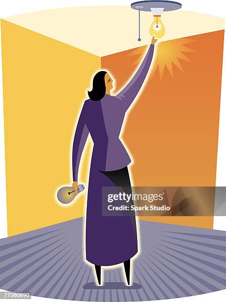 a woman changing a light bulb - ceiling lighting stock illustrations