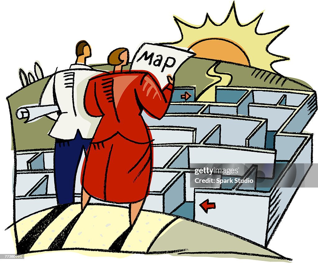 A man and woman using a map to navigate through a maze