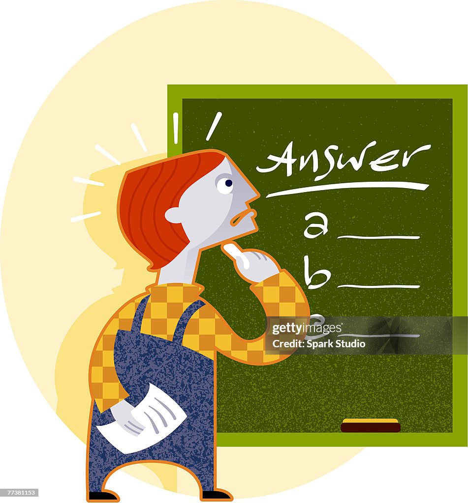 A student attempting to answer a multiple choice question on a blackboard