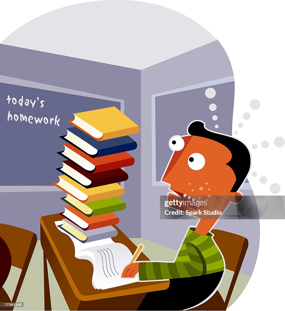 A boy looking at a big stack of homework on his desk