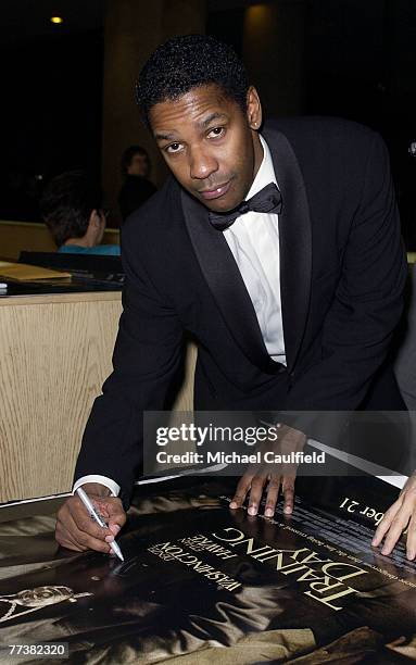 Denzel Washington signs poster.