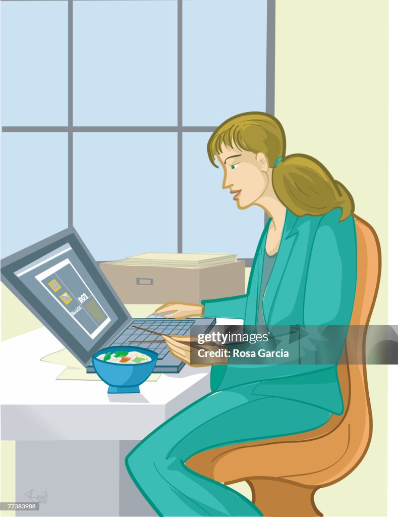 A businesswoman working during her lunchtime