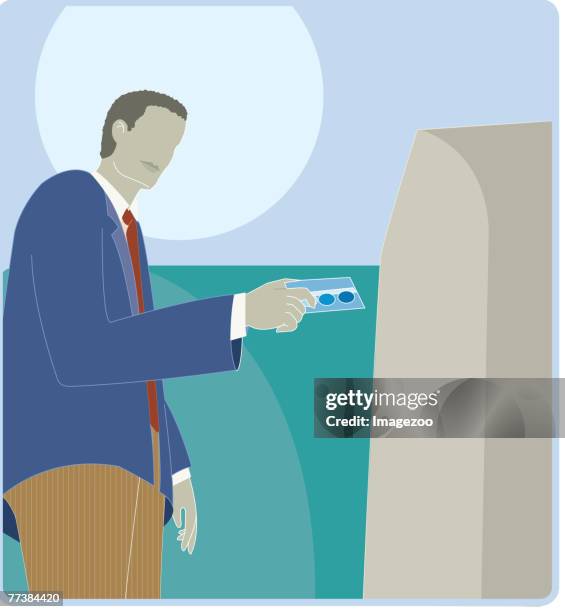 a man using an instant teller machine - using debit card stock illustrations