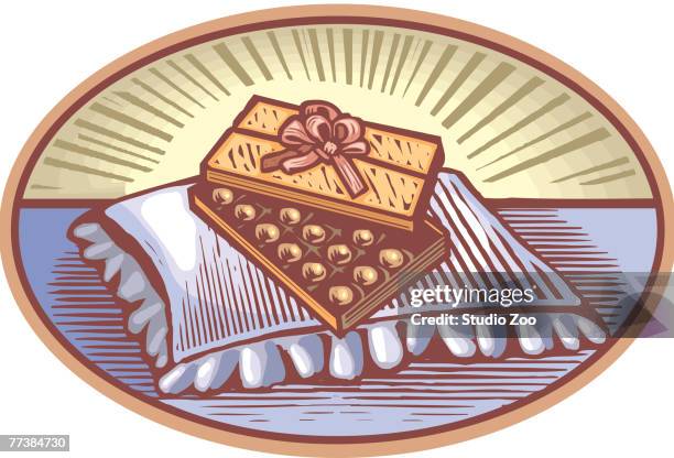 box of chocolate on a pillow - commercial cleaning services stock illustrations